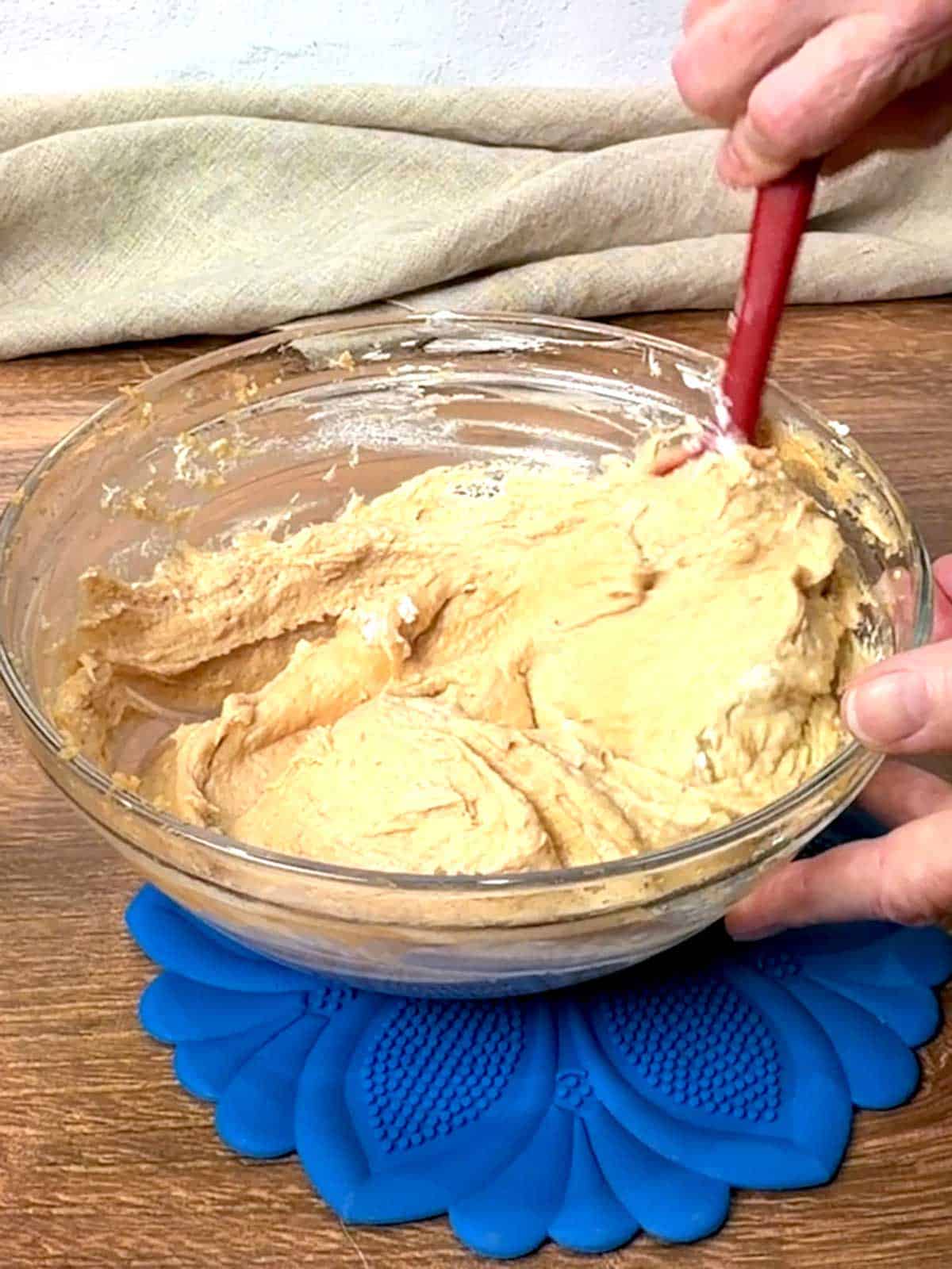 Folding cream into peanut butter mixture.