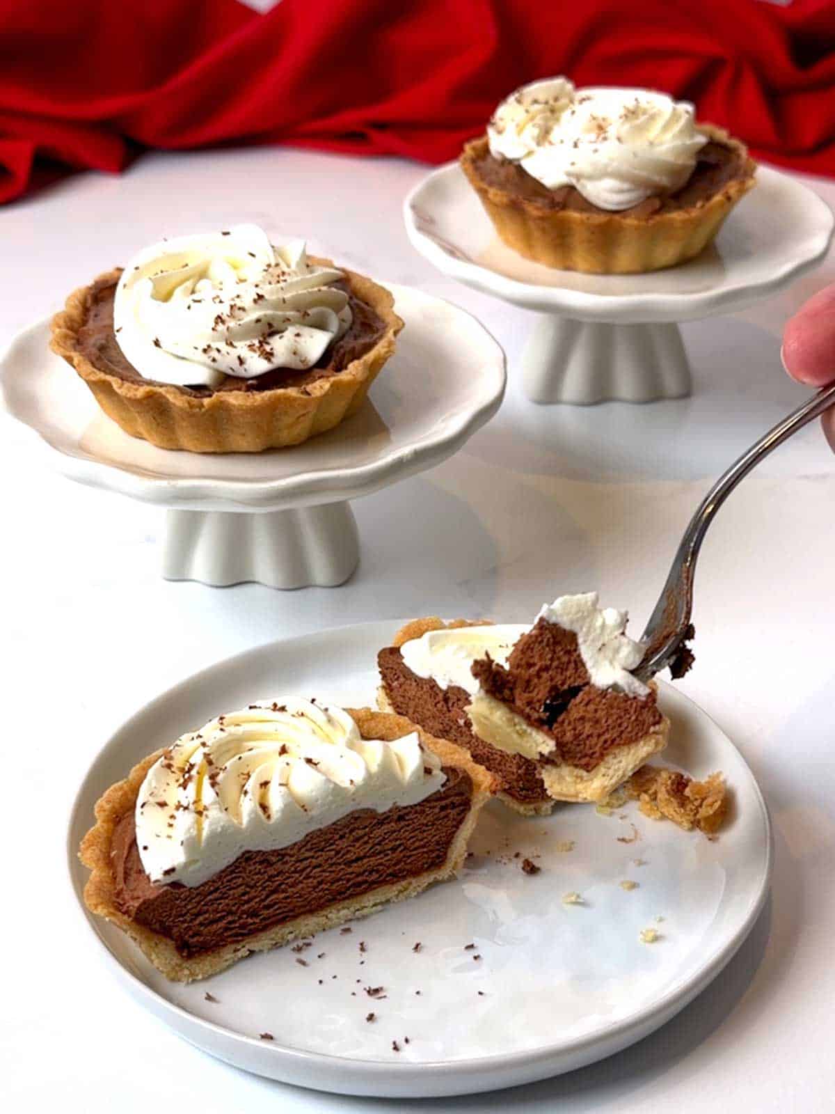 Taking a bite of the chocolate mousse tart.