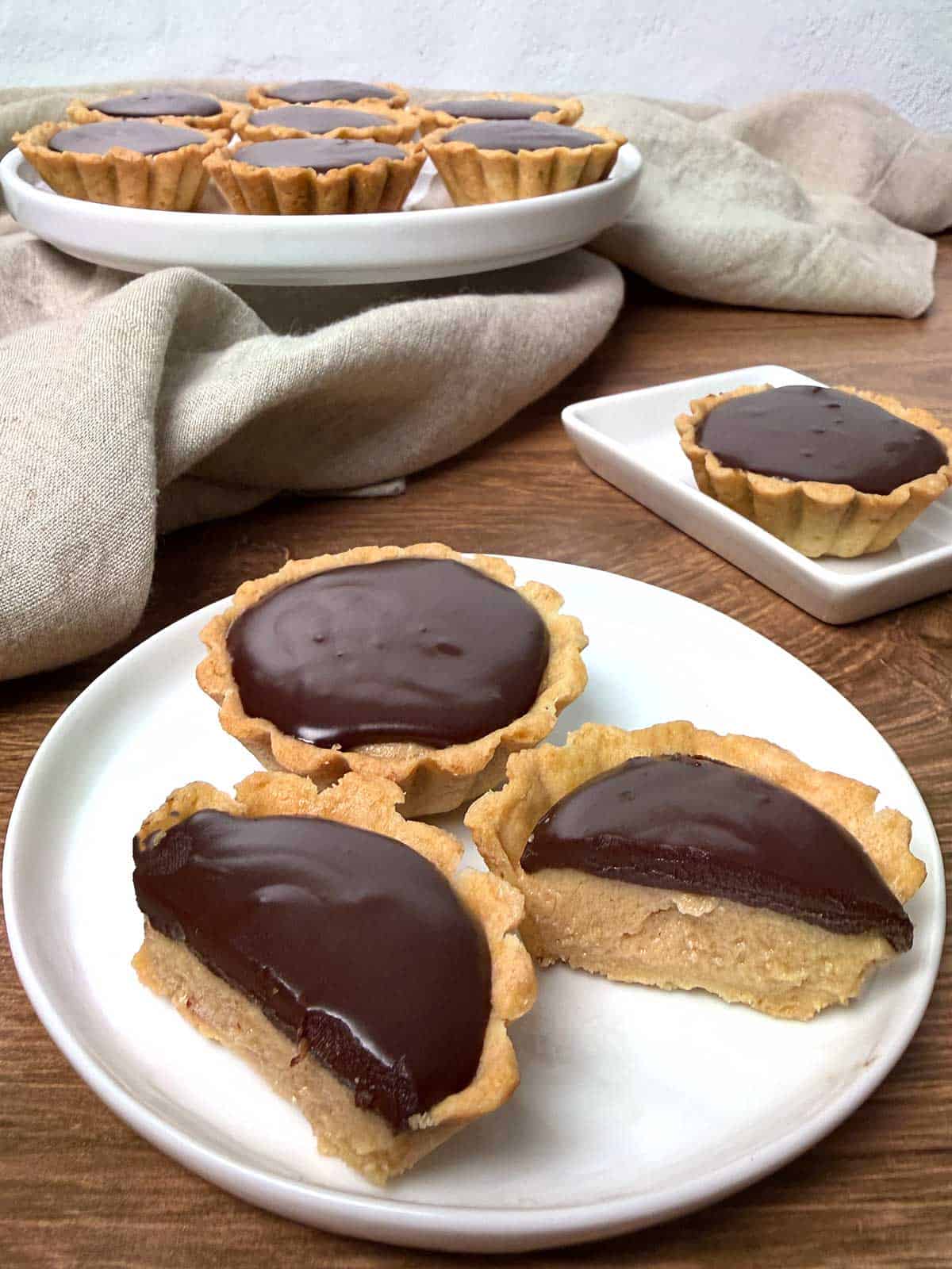 Mini peanut butter tarts with chocolate ganache.