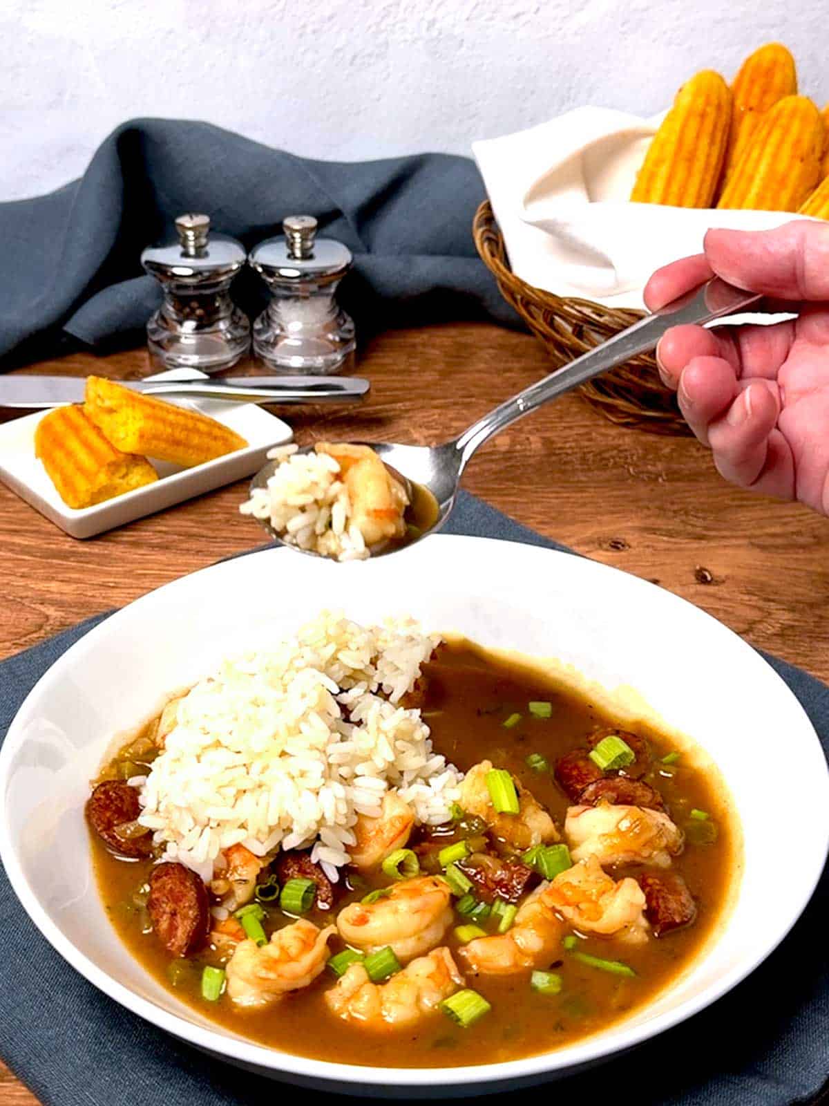 Eating the gumbo.