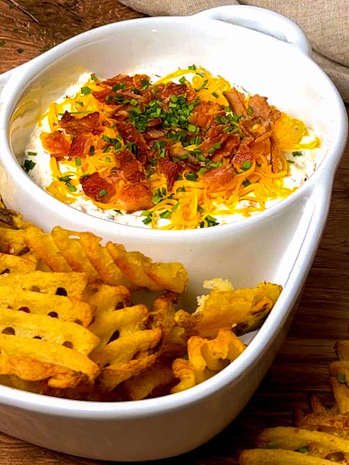 Loaded baked potato dip with waffle fries.
