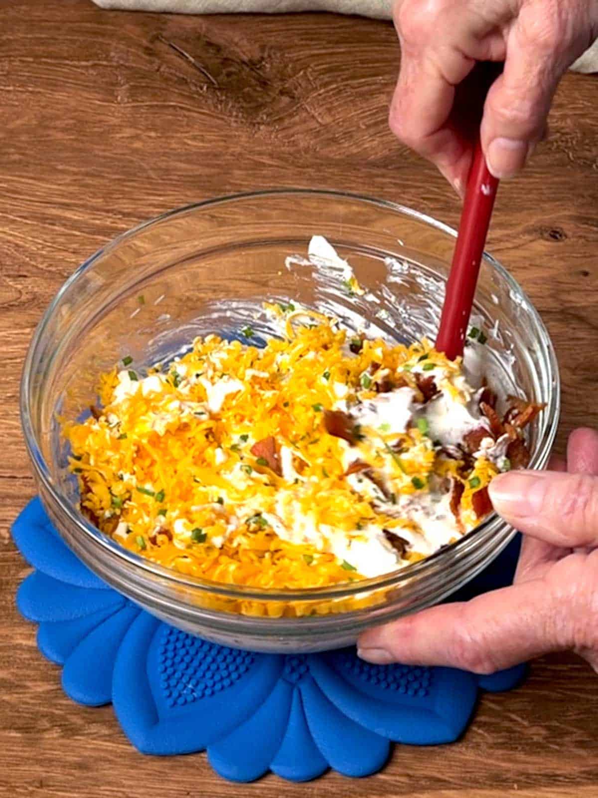 Mixing the dip ingredients.