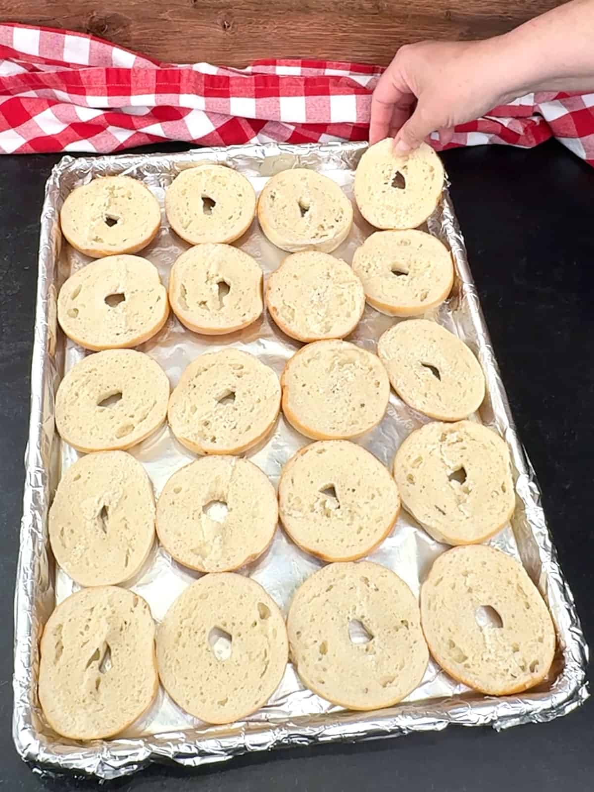 placing bagels on prepared pan