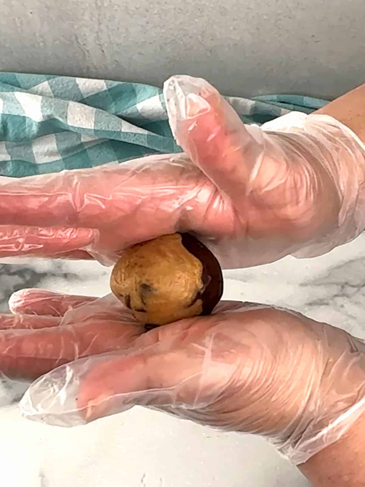 rolling dough between hands