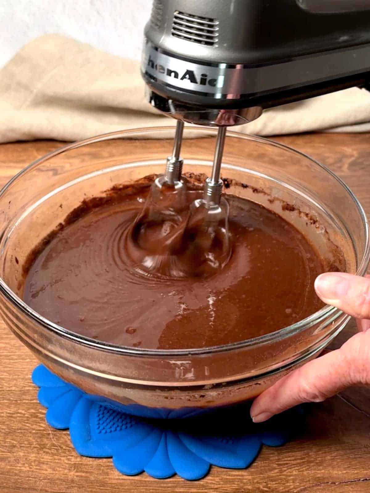 Beating the chocolate cake batter.
